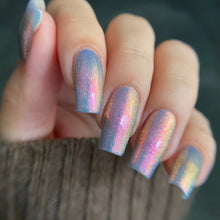 "Glitter in the Air" is a soft sky blue packed with glowing pink/gold/green shifting shimmer.

15ml Bottle