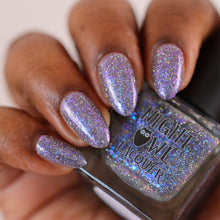 "Don't Pretend You Care About Me Werewolf" is a grey crelly filled with glowy iridescent flakes that shift blue/purple, charcoal sparkle micro flakies and silver holographic micro glitter flake.

15ml Bottle