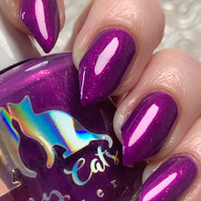 Sassy Cats Lacquer continues their 'For the Love of Cats' series with "Now Just Wait a Meowment."

"Now Just Wait a Meowment" has a midnight purple base with magenta glowy shimmer plus micro rose pearl flakies.

15ml Bottle

100 Cap﻿