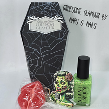 "Gruesome Glamour" is a solar polish that is a neon green in the shade to a murkey purple in the sun or uv light with black metallic flakes.

Comes in a thick paper coffin box with a zombie sticker and a strawberry lip sucker.