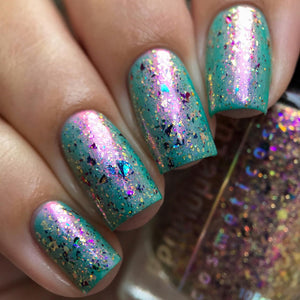 Penelope Luz continues their 'Goddesses of Mythology' series with polishes inspired by Lakshmi!  "Lakshmi" has a baby green base with Red/gold shimmer.  "Goddess of Abundance" is a TOPPER that has colorful flakes and a little gold holo glitter.  10ml Bottles