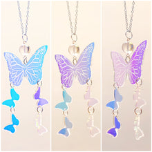 Baroness X brings us a Magical & Witchy necklace inspired by butterflies with iridescent wings.

This necklace is made of mermaid beads and iridescent acrylic. The outline of a butterfly is etched in the large acrylic butterfly.

The tarnish resistant chain is 18" with a 2" extender with a silver bead finishing off the end of the extender.

The butterflies and mermaid bead hang approx. 3" from the necklace.