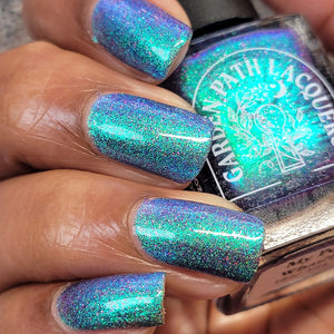 Garden Path Lacquers continues their 'Retro Toys' theme with a polish inspired by My Pet Monster.

"My Pet What?!" is a teal-turquoise jelly base filled with purple holographic microglitters and blue/green Aurora shimmer.

12ml Bottle

No Cap

