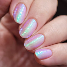 Whatcha Indie Polish continues their 'Zodiac' series with a polish based off of the star sign, Cancer!  "Cancer" is a pinkish-grape crelly with green-blue shimmer and gold microparticle.  10ml Bottle