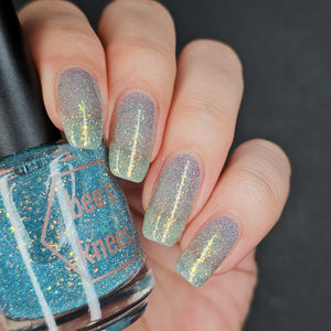 Bee's Knees Lacquer continues their 'Belladonna' series!  "It's Time That You Burn" is a steel blue with sky blue light reflective glitter and gold to green ghost flakes. Please note that this formula will be thicker because of the extra light reflective glitter.  15ml Bottle