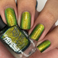 Grace-full Nail Polish continues their 'Seven Deadly Sins' series with a polish inspired by Envy!  "Green Eyed Monster" features an Aurora shimmer that transitions through olive green, green, and gold hues with ultra chrome chameleon flakes in green and gold.  12ml Bottle