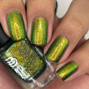 Grace-full Nail Polish continues their 'Seven Deadly Sins' series with a polish inspired by Envy!  "Green Eyed Monster" features an Aurora shimmer that transitions through olive green, green, and gold hues with ultra chrome chameleon flakes in green and gold.  12ml Bottle