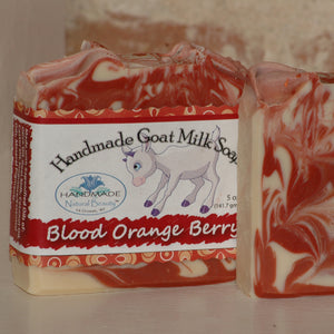 Handmade Natural Beauty presents the next seasonally-inspired luxurious Goat Milk Soaps in the "Seasonal” series. "Blood Orange Berry” features a white base with pink and purple swirls. Mica swirls and a dash of biodegradable holographic cosmetic glitter adorn the top.  This fragrance can be described as a deliciously juicy and sweet blend of Blood Orange, Tangerine Leaf, Italian Bergamot, Tangelo, Sheer Floral Petals and Raspberry.