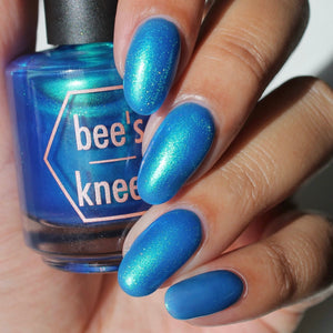 Bee's Knees Lacquer has chosen to bring back a polish from their I.N.K. series for their Encore this month!

"Evil Comes In Every Size 2.0" is a mid-toned blue Doomicorn sister with the same green to blue shimmer.&nbsp;Note: it may be a darker blue than the original formula, but we did our best to recreate it.