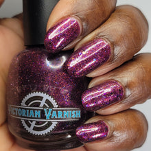 Victorian Varnish wraps up their 'Apotheker Peculiarities' series with a polish inspired by Wizarding Apotheker!

"Cold Fusion" has an eggplant to magenta leaning Base, pink shimmer, black micro flakes, ghost flakies, scattered holo, and an assortment of glitters. A true kitchen sink polish that sparkles and dazzles in all directions.