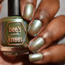 Bee's Knees Lacquer continues their 'Fallout' series!

"Waylaid By Bullsh!t" has a grungy olive base with light blue shimmer.