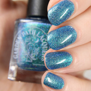 Garden Path Lacquers has created a polish for the holidays inspired by the Winter Solstice and the return of light to the world.

"The Return of Light" has a blue jelly base contains blue/aqua shifting multichrome shimmer and silver holographic microglitter.