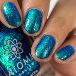 Atomic Polish continues their 'Board Game' series with a polish inspired by Mysterium!

"Mysterium" is a vivid blue-based polish with aurora pigment that shifts green to blue and flakes that shift from green to blue. Opaque in 2 coats.