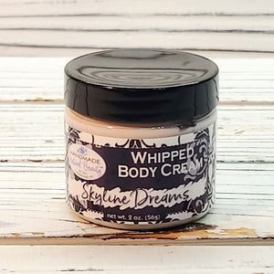 Handmade Natural Beauty is pleased to offer another one of our popular moisturizers this month! Shea Butter Whipped Body Cream in "Skyline Dreams". The scent is midnight jasmine and can be described as a floral yet sultry scent, reminiscent of a night out in the city (Don't forget to exfoliate with the Foaming Sugar Scrub also offered this month in a matching scent!)