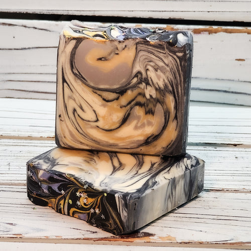 The first in this theme is a luxurious moisturizing goat milk soap inspired by New York City. It is a white, black, gold and silver swirled soap inspired by the sparkling nighttime skyline of the city that never sleeps, called “Skyline Dreams.”

The scent is midnight jasmine and can be described as a floral yet sultry scent, reminiscent of a night out in the city.