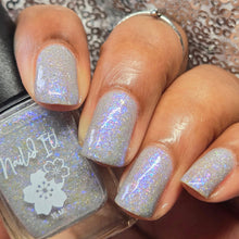 Nailed It! continues their 'Avatar: The Last Airbender' series with a polish inspired by Katara!

"Power From The Moon" has a light gray base with blue/purple and pink/gold crystal flakies, and holo flakes.