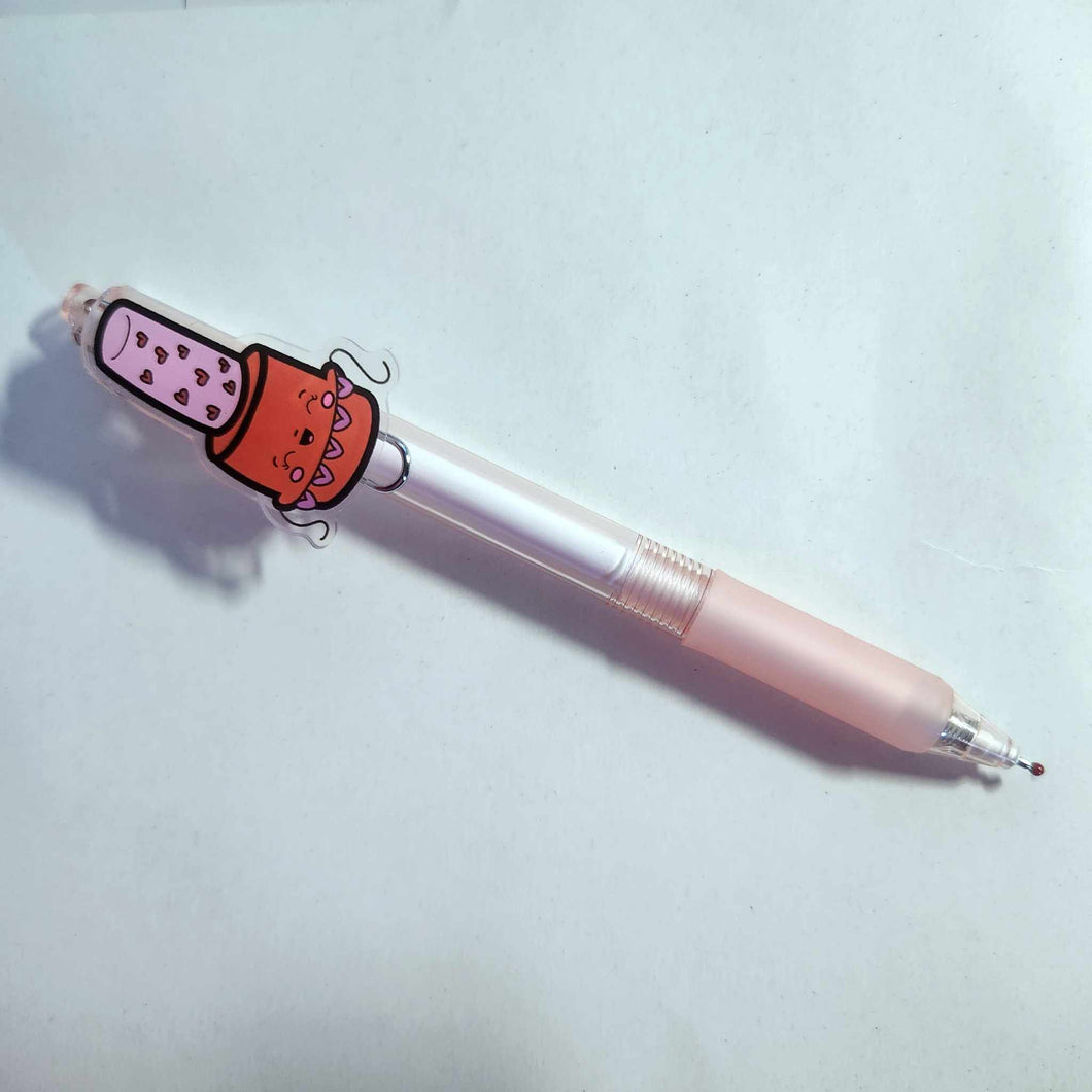 The pen has an acrylic red with a pink cap holding a string of hearts nail polish charm. The pen has a pink plastic casing with a fine point gel ink, just substitute one for another.

Pen point size: 0.5mm