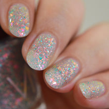 "Dreamlight Wings" is a turquoise micro-flake topper with reflective glitter, and iridescent flakes in a clear base.

11ml Bottles