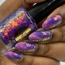 "Are You Ready, Kids?" is a yellow/pink magnetic polish with blue aurora shimmer.

"Aye, Aye Captain!" is a topper with a purple jelly base with pink/orange iridescent flakie.

11ml Bottle