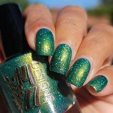 "Make a Better Place for You and for Me" is a deep jade green with a green-gold-orange shifting shimmer and holographic flakes.

15ml Bottle