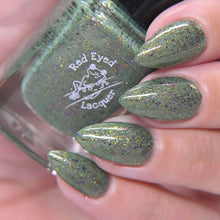 "Torterra" is a medium grass green with purple/gold shifting holo micro flakes!

12ml Bottle