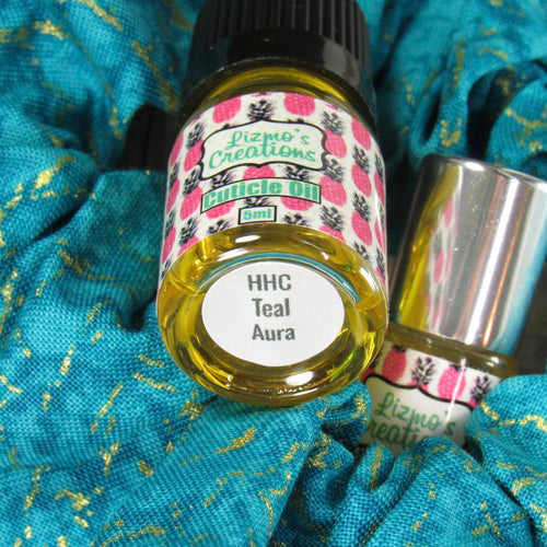 Items - Scrunchie+ with 2ml cuticle oil scented with Teal Aura
5ml refill bottle scented with Teal Aura
Scrunchie+ Description -teal background with shimmering gold vein-like accents
Scent - Teal Aura blends the soft sophistication of crisp bergamot, rich mahogany, and smooth musk all wrapped up in a warm hug of creamy vanilla sweetness.