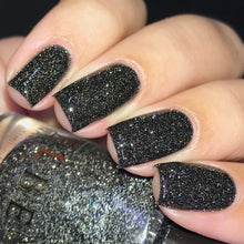 "Jazz" has a black base with silver reflective glitter and galaxy holo glitter.

11ml Bottle