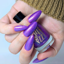 "What More in the Name of Love" has a bright violet base with green-yellow-orange shifting shimmer and purple metallic flakes.


15ml Bottle