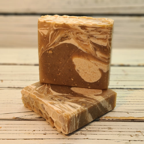 The design features soft natural golden and ivory swirls in a creamy base with a flat top with honeycomb impression.

The Nashville, TN inspired scent can be described as: Warm, comforting, and as smooth as a Southern song, this rich blend of oatmeal, milk, and honey wraps you in creamy sweetness with a hint of toasted warmth — a true Nashville classic in scent form. This soap matches our bath and body products offered this month!