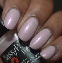 A captivating, pale pink polish ocean-kissed with a hint of blue shimmer and microflakies of both pink and blue, inspired by the birthplace of Aphrodite, Goddess of Love, born from the sea. Sea of Love reflects the romance and allure of rolling waves, sea spray, and endless horizons — sensual, luminous, and irresistibly wearable.