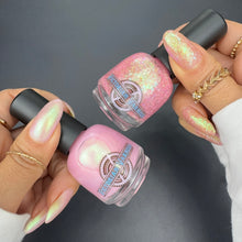 "Moms Are Like Buttons" has a sheer Lilac/Pink base with an aqua/green/purple aurora shimmer.

"They Hold Everything Together" has a clear base with an intense aqua/green/purple shimmer, pink and peach reflective glitters, and Ghost flakies in blue/peach/pink/green/aqua.

17ml Bottles