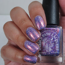 "It's Ba Boy!" has a periwinkle crelly base filled with blue holographic microglitter, holographic microflakes, and pink-leaning Aurora shimmer.

12ml Bottle