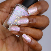 "True as Your Colors" is a pearlescent white based polish with multicolored micro flakes to represent a rainbow.

15ml Bottle