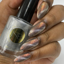 "Lionfish" has a blue/gray base with orange/pink/yellow shimmer.

"Beautiful and Dangerous" has a transparent base with magnetic silver and holographic micro flakies.

11ml Bottles