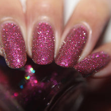 "Love You 2-5" has a sheer but buildable multichrome base of pink to orange to yellow/green at the extremes with silver reflective glitter, and iridescent pink/orange flakes.

15ml Bottle