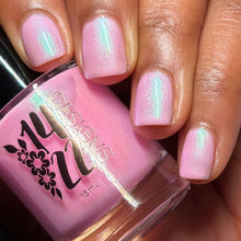 "Ballet Betty" is a cool, pale pink with a strong purple-blue-teal shifting shimmer.

15ml Bottle
