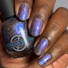 "Blurple Brilliance" has a sheer jelly grayed blue base with a beautiful shimmer ranging in deep blues and purples (blurple) depending on lighting with scattered holo flakies.

17ml Bottle