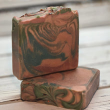 Handmade Natural Beauty continues our 2026 Myth &amp; Muse collection with “Gaia,” inspired by Mother Earth and the grounding force of nature.

This moisturizing goat milk soap features layered swirls of mossy greens, earthy browns, and soft neutral tones. A textured top mimics natural terrain with subtle mineral accents, and a light dusting of bronze mica evokes sunlight filtering through forest canopies. The overall aesthetic feels organic, rooted, and deeply grounding.