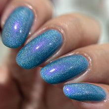 "Rainbow" has a teal base holographic polish with purple/red shimmer.

11ml Bottle