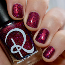 "Pirates" is a deep red to gold orange multichrome with a purple base and holo glitters.

13ml Bottle
