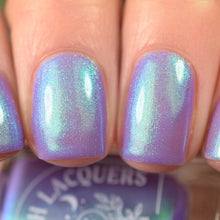 "Once More, With Feeling!" is a creamy, periwinkle purple crelly based accented with an aqua shifting aurora shimmer.

12ml Bottle