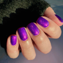 "Velvet Rope Vendetta" has a royal violet base with fuchsia shimmer and micro flakies.

15ml Bottle