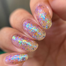 "Dimensional God" is a topper that has a mix of iridescent flakies and blue/purple multichrome flakies.
Note: Some swatches shown over a base color.

10ml Bottles