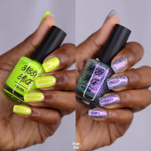 "Inclusion Matter" has a seafoam-sage toned base with violet-pink shimmer, reflective glitters and UCC flakes.

"Loving Out Loud" is a neon chartreuse with pink shimmer and tiny ghost flakies.

15ml Bottles