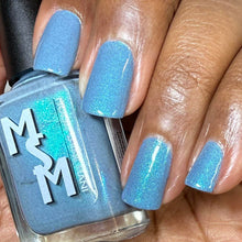 "Dreamlight Winter Ball" is a snowy blue-gray glowing with three shimmers shifting aqua/sapphire, fuchsia/blue/purple, and green/teal.

15ml Bottle