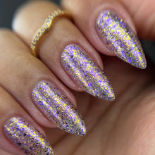 "Emeraude Reborn" has a mix of iridescent flakies and purple metallic micro flakies.

10ml Bottle