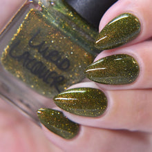 "Sister Bear" has a deep olive green base with bronze reflective glitter and aurora shimmer that twinkles in shades of copper, gold, and green.

15ml Bottle