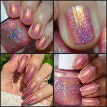 "A Rhinestone Shines Just As Good As A Diamond" has a soft rosey pink base with striking yellow/golden shifting shimmer and full of silver holographic pigment.

15ml Bottle
