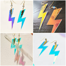 Baroness X continues their 'Magical & Witchy Things' series with a pair of earrings inspired by casting spells!

These earrings are made of mermaid beads and lightening bolts in brass and iridescent acrylic. The hardware is treated with tarnish resistant coating and the earring hooks are hypoallergenic.

They hang 3" from your ear piercing, and they are .8" wide at the widest point.

Cap TBD