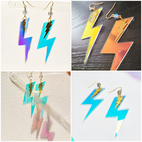 Baroness X continues their 'Magical & Witchy Things' series with a pair of earrings inspired by casting spells!

These earrings are made of mermaid beads and lightening bolts in brass and iridescent acrylic. The hardware is treated with tarnish resistant coating and the earring hooks are hypoallergenic.

They hang 3